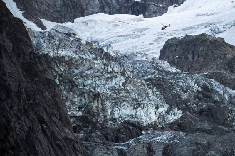 During a helicopter flypast, an AFP reporter saw a gaping chasm on the lower part of the Planpincieux, from which two cascades o