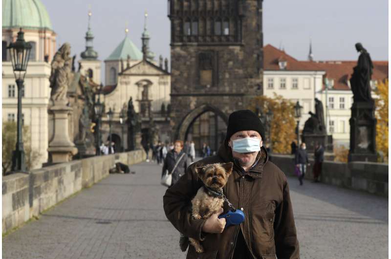 Europeans face more curfews, restrictions, as virus surges
