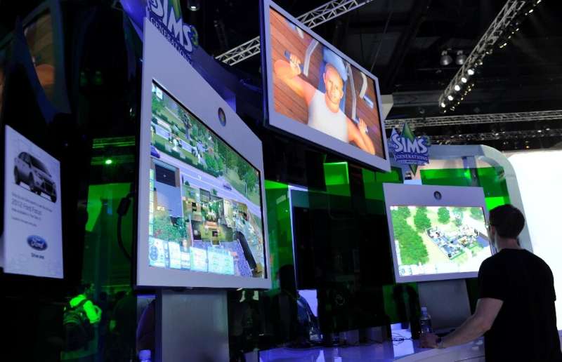(FILES) In this file photo taken on June 09, 2011 Gamers plays the video game &quot;Sims&quot; at the Electronic Entertainment E