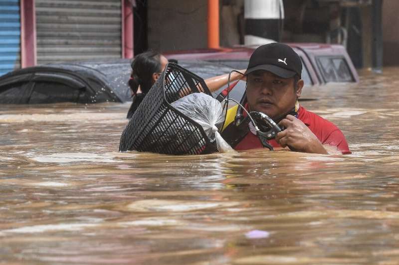 Flood water in some Manila streets was up to shoulder height