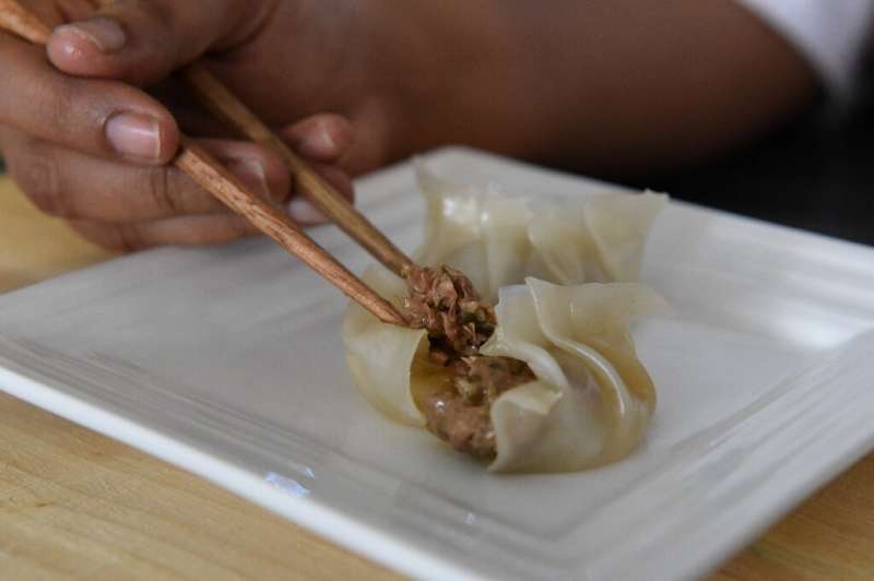 Foodie start-up Karana chef-in-residence Sowmiya Venkatesan displaying a plant-based &quot;pork&quot; and chive dumpling made fr