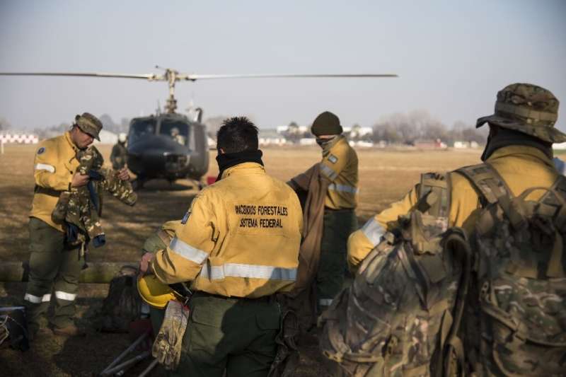 Forest fire fighters preparing to take to the skies to battle the thousands of fires raging across the Parana Delta marshes