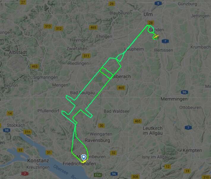 German pilot traces giant syringe in sky to mark Covid jabs