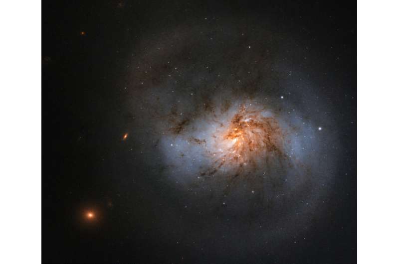 Hubble sees dusty galaxy with supermassive center