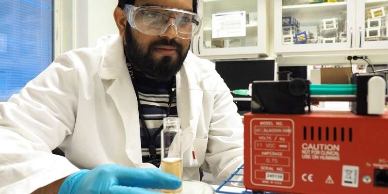 Identifying the source of water pollution using synthetic DNA sand