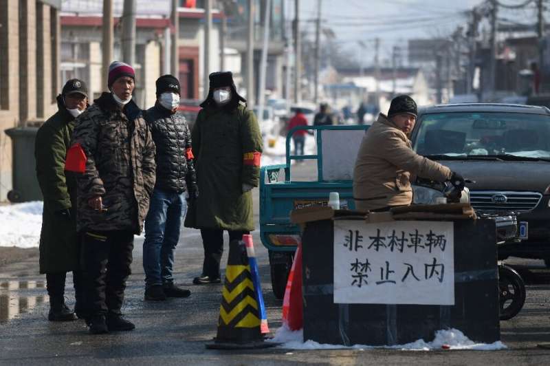 In some places, such as Jiuduhe north of Beijing, residents have sealed off their village in an effort to prevent the spread of 