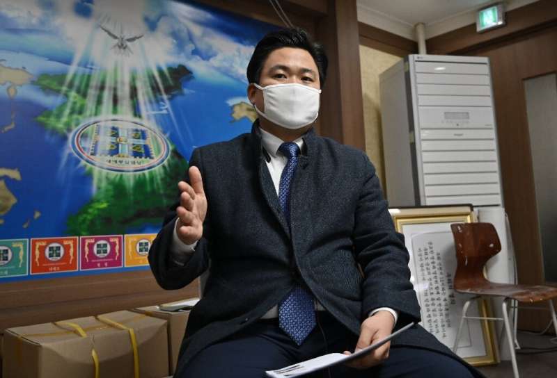 Kim Shin-chang, a Shincheonji Church of Jesus, official wearing a face mask during an interview with AFP. The church is linked t