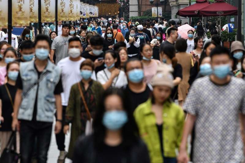Many people in Wuhan, where the coronavirus first emerged, are still wearing masks despite there being no new cases since May