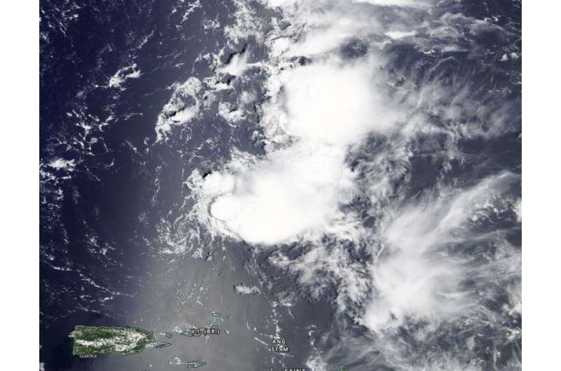 NASA sees former Tropical Storm Josephine open into a trough