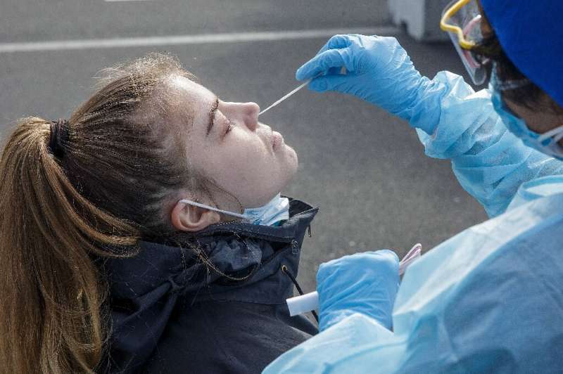 New Zealand is battling its own second wave of infections and extended a lockdown of its largest city by at least 12 days