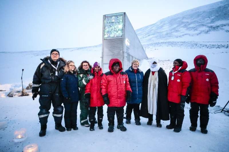 Norway's Prime Minister Erna Solberg, fourth from the right, and other representatives outside the vault
