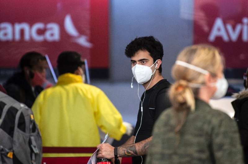 Passengers at the Avianca check-in area in Mexico City's  Benito Juarez airport International airport on May 20, 2020