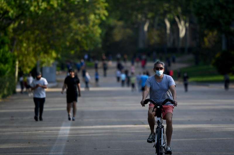 People exercise at Madrid's famous Retiro Park, which reopened for the first time in more than two months