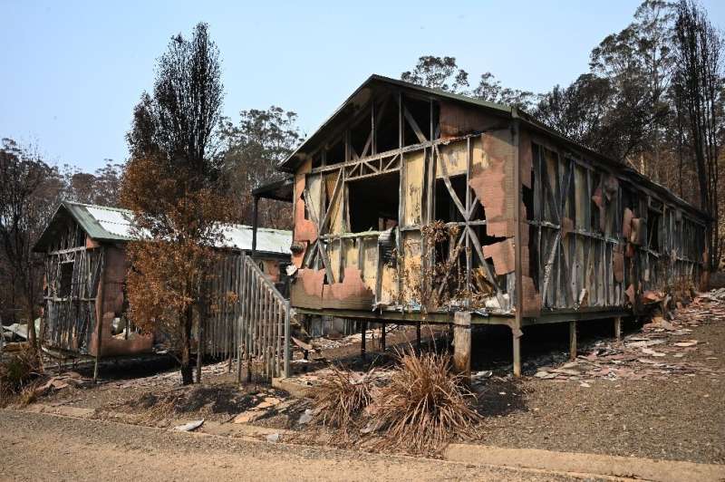 Shops and tourist attractions have been reduced to ruins in Mogo, New South Wales