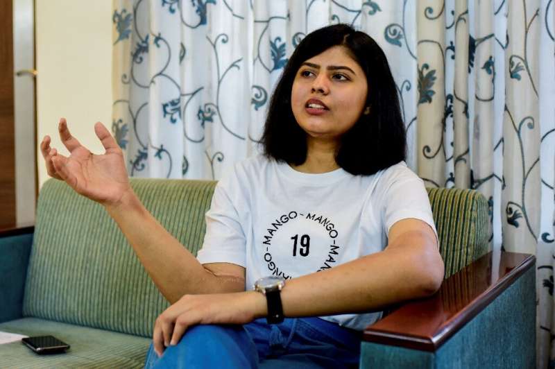 Shreya Siddanagowder gestures during an interview with AFP at her home in Pune, more than two years after she had both hands tra