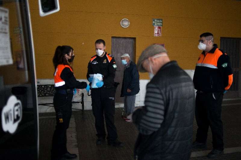 Some 4,500 police, Red Cross volunteers and security guards handed out masks at 1,500 locations across Spain
