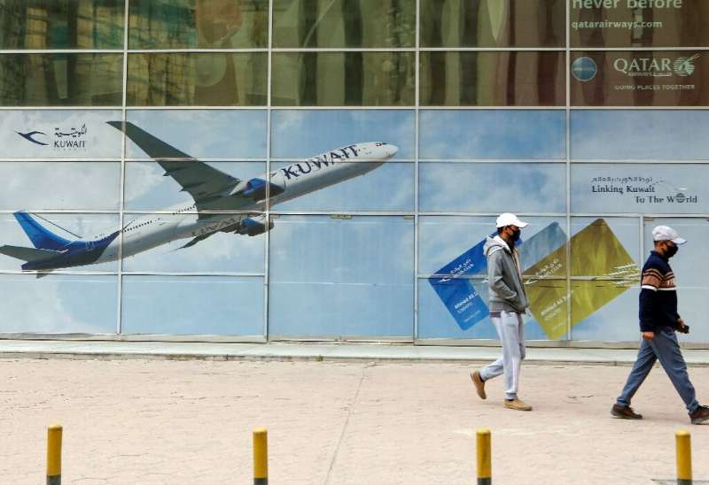 State-owned Kuwait Airways said it will lay off 1,500 expatriate employees due to &quot;significant difficulties&quot; caused by