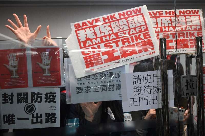 Striking medical workers demand Hong Kong close the border with China to contain the virus