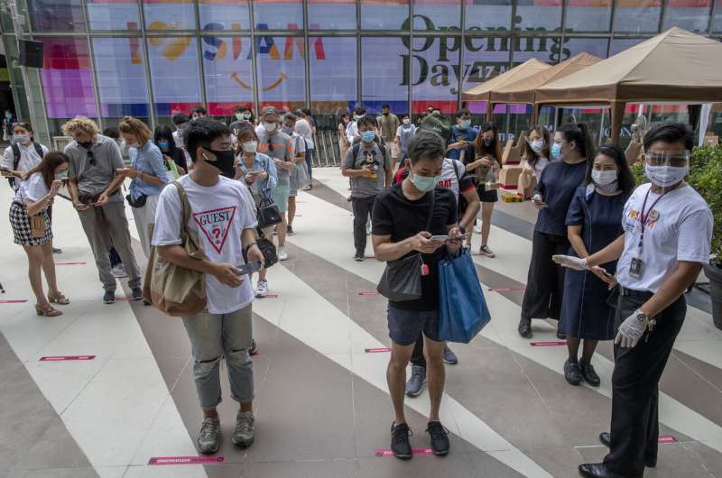 Thailand malls reopen, with temperatures taken, masks worn