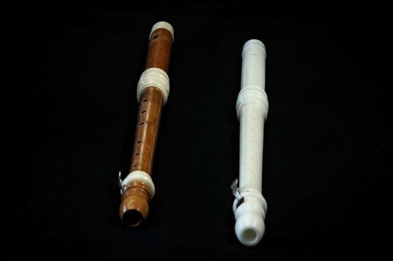The 3D reproduced instrument is a flute made out of white plastic, a copy of a handmade version of an original early 18th-centur