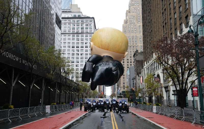 The &quot;Boss Baby&quot; balloon floats during an uncharacteristically subdued Macy's Thanksgiving Day Parade in New York on No