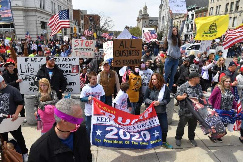 The US has seen small protests against lockdown policies—here people attend a &quot;reopen&quot; Pennsylvania rally this week