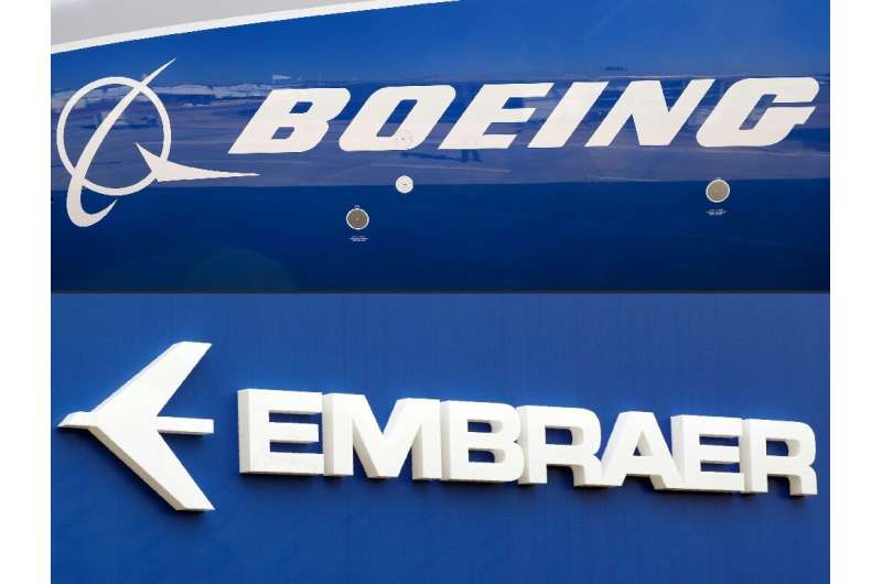 This combination of file pictures created on December 21, 2017 shows the Boeing logo on the fuselage of a Boeing 787-10 Dreamlin