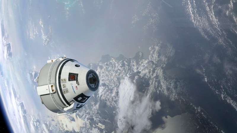 This NASA/Boeing handout image shows an artist concept of the CST-100 Starliner in Earth's orbit