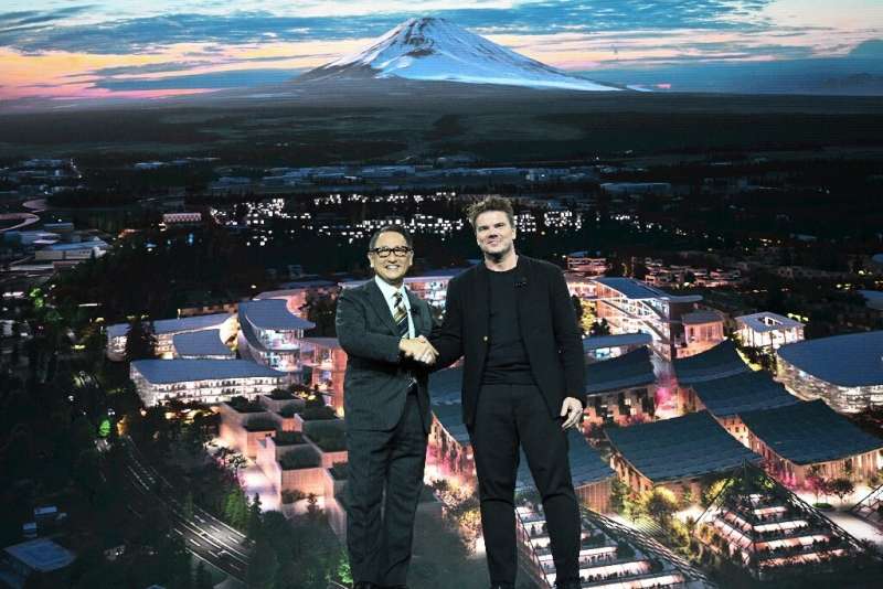 Toyota President and CEO Akio Toyoda (L) and Danish architect Bjarke Ingel reveal plans for a prototype &quot;city&quot; of the 