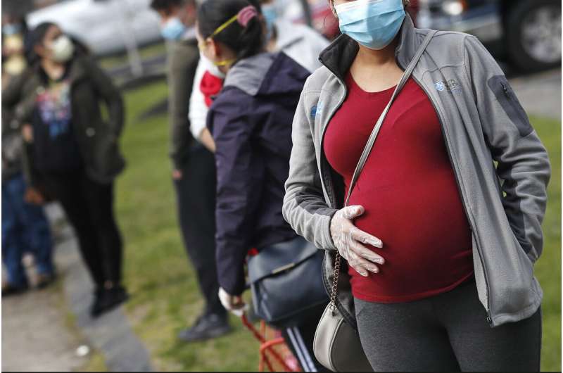 U.S. officials change virus risk groups, add pregnant women