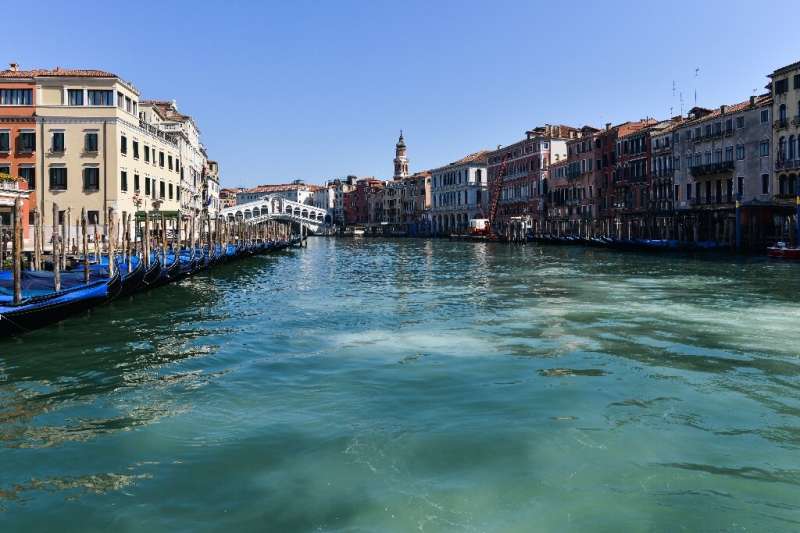 Venice is enjoying crystal clear waters in its canals due to a lack of debris from tourists and near-zero boat traffic under Ita