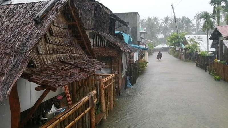 1 dead, 100,000 displaced as typhoon blows near Philippines