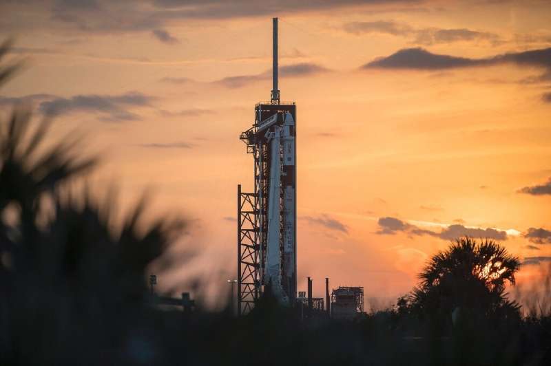 A SpaceX Falcon 9 rocket with the company's Crew Dragon spacecraft onboard seen on the launch pad at Launch Complex 39A