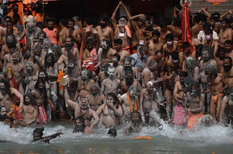 Despite rising virus cases, pilgrims have gathered in huge numbers at the Ganges to take part in the event