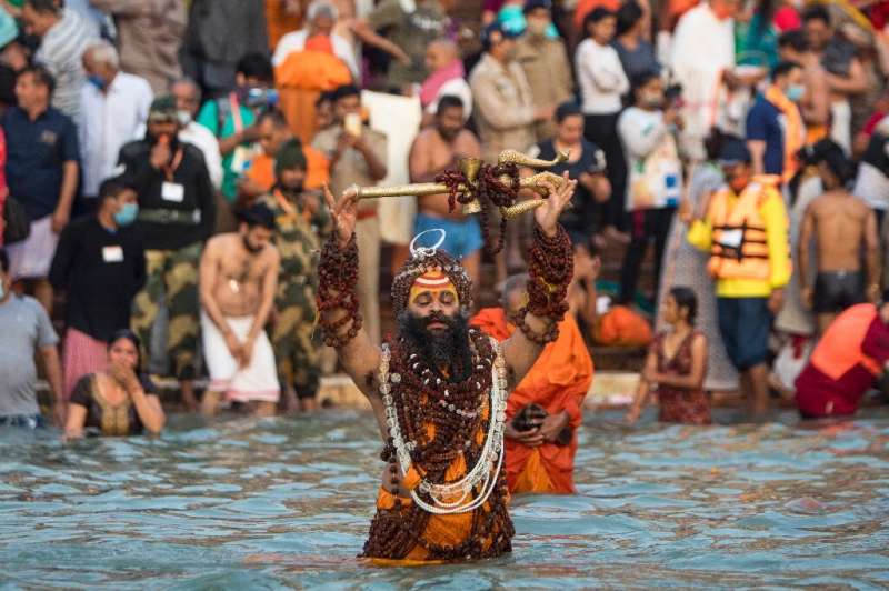 Hundreds of thousands of mostly maskless Hindu devotees have descended on the River Ganges for the event
