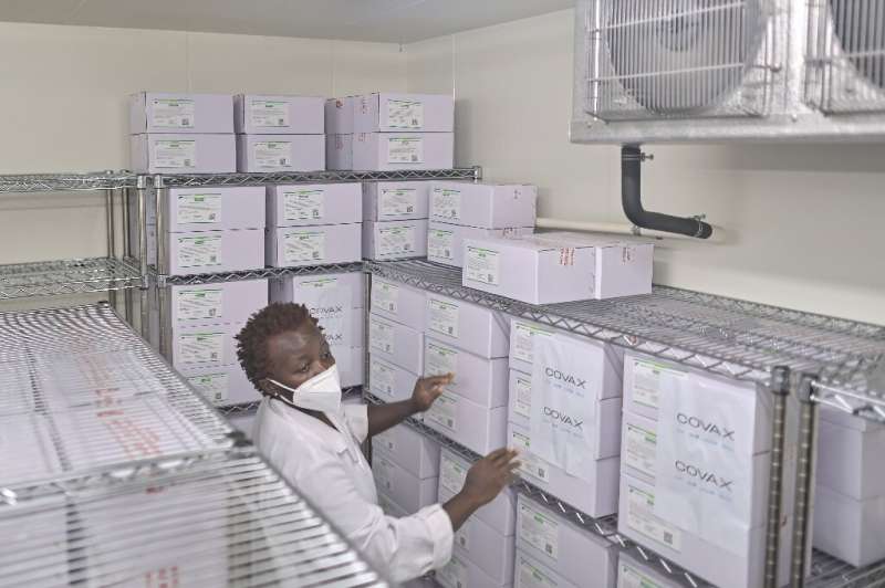 Medical personnel at the Nairobi National Vaccine Depot, where the country's first batch of COVID-19 vaccines are preserved in c