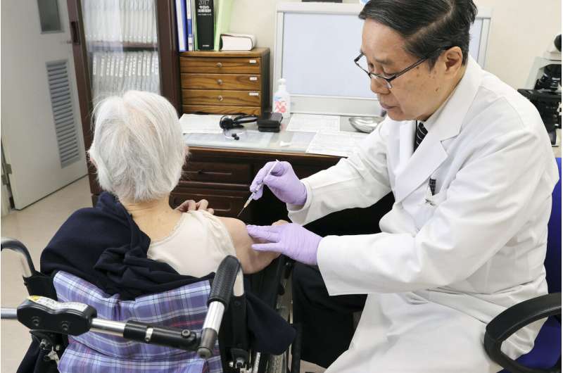 Tokyo adopts tougher virus rules, starts vaccinating elders