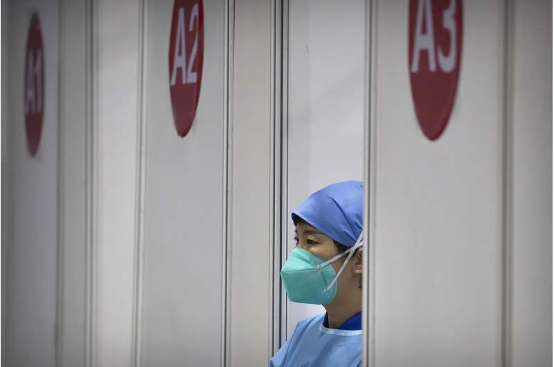 China builds hospital in 5 days after surge in virus cases