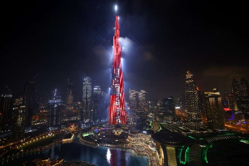 Dubai's Burj Khalifa is lit up in red with an slogan reading in Arabic, &quot;Mission accomplished&quot; after the UAE's &quot;H