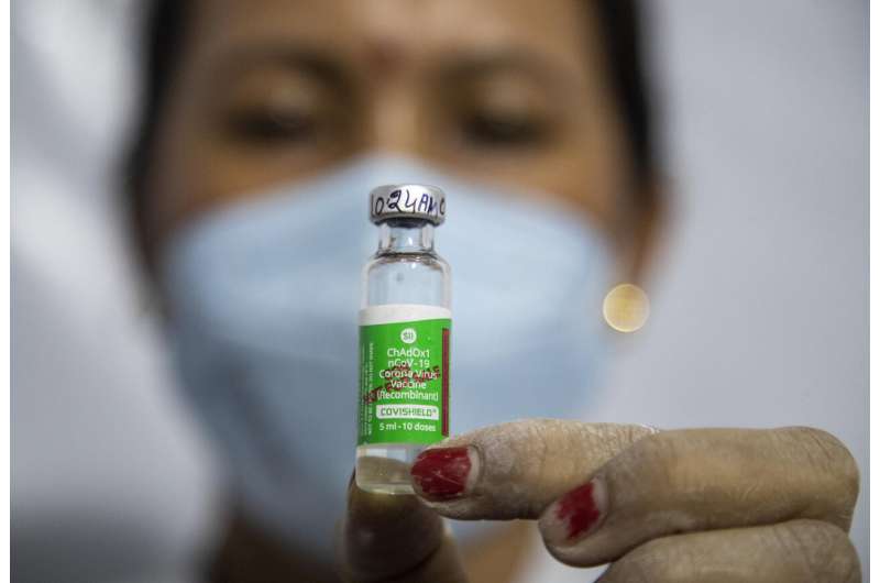 India fights virus surge, steps up jabs amid export row
