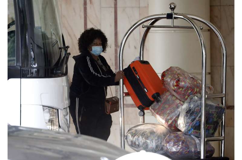 UK opens quarantine hotels, pushes on with vaccine drive