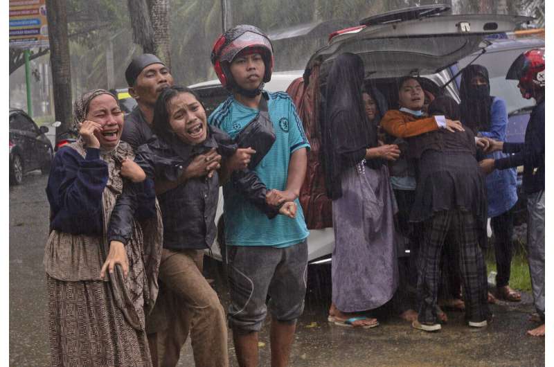 At least 34 dead as Indonesia quake topples homes, buildings