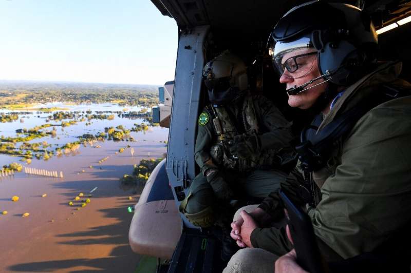 Australian Prime Minister Scott Morrison surveys the floods around Sydney from an army helicopter