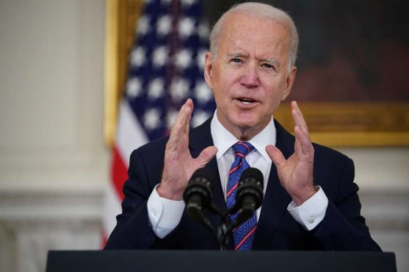 US President Joe Biden speaks about the March jobs report and Covid-19 in the State Dining Room of the White House