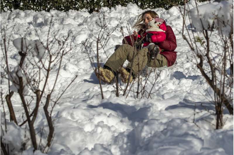Spain shovels out of snowdrifts left by Storm Filomena