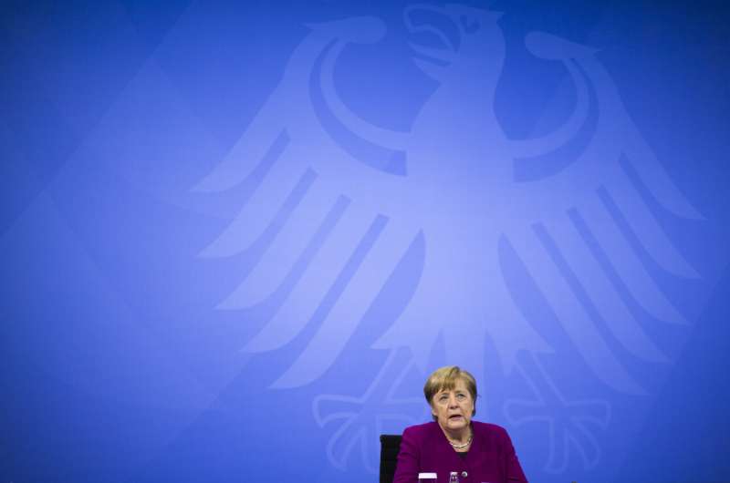 Germany extends lockdown but paves way to relax more rules