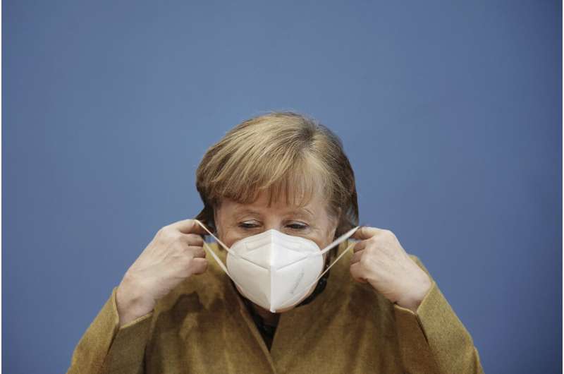 Germany's Merkel points to variant risk as infections drop