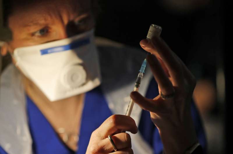 UK vaccination drive expands as virus toll nears 100,000