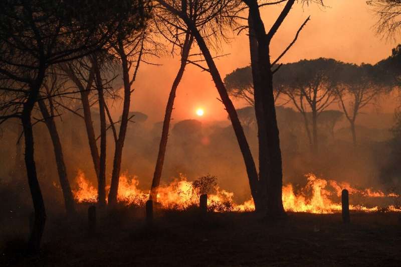 A blaze raging in southern France has killed two and forced thousands to flee