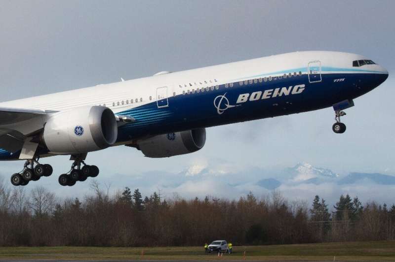 A Boeing 777X airplane takes off on its inaugural flight on January 25, 2020